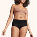 Soft Cotton Classic Washable Underwear Light Incontinence showcased on a model, highlighting its high-cut design and comfortable waistband, emphasizing functionality and eco-friendliness.