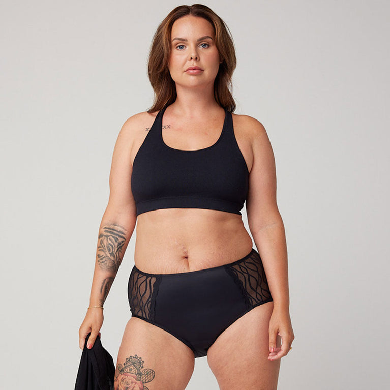Silhouette Classic Washable Underwear for Light Incontinence, featuring a woman modeling sleek, black sports-style panties with built-in protective gusset for discreet leak protection.
