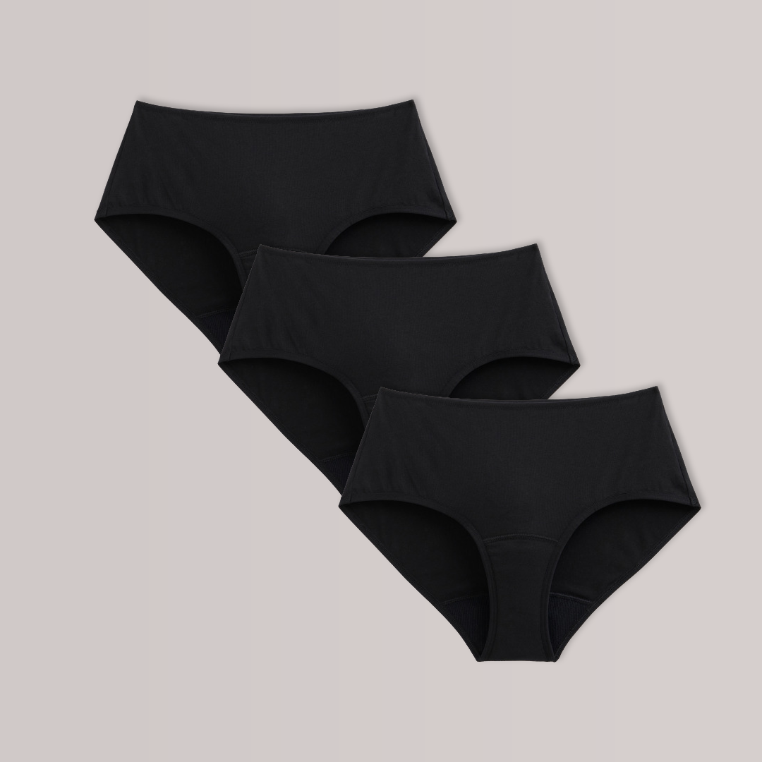 TENA 3 Pack Organic Cotton Underwear, showing three black briefs for women, designed for light bladder leaks, displayed overlapping on a gray background.