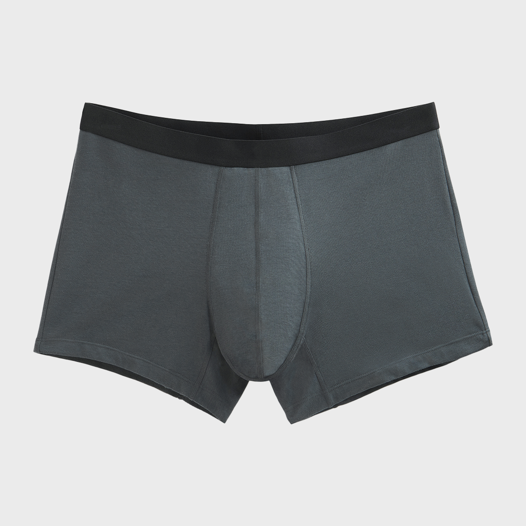 NEW TENA Men Protective Boxers, featuring a black waistband and crafted from soft organic cotton, offer discreet incontinence protection with a sleek, everyday design.