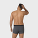 NEW TENA Men Protective Boxers shown from the back, worn by a shirtless person, highlighting the dark-gray design and comfortable fit with a stretchy waistband.