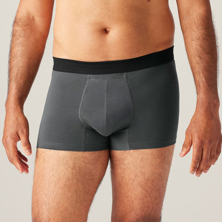Man wearing TENA Men Protective Boxers Light, showcasing the comfortable fit and invisible built-in protection for light incontinence, resembling everyday underwear.