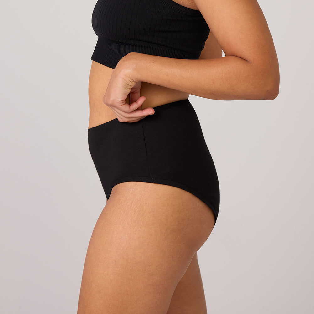 TENA 3 Pack Organic Cotton Underwear, shown in black, features a ribbed crop top and high-waisted design, emphasizing comfort and fit for light bladder leak protection.